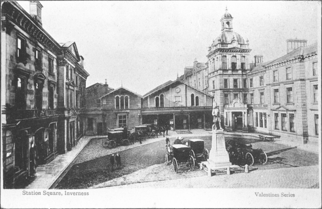 1895 photo of the square in front of the Inverness, Scotland train station filled with horse drawn coaches.